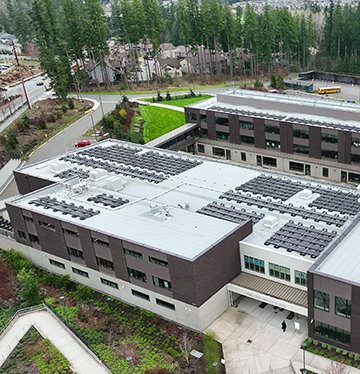 Aerial view of solar panels on top of building at Pine Lake