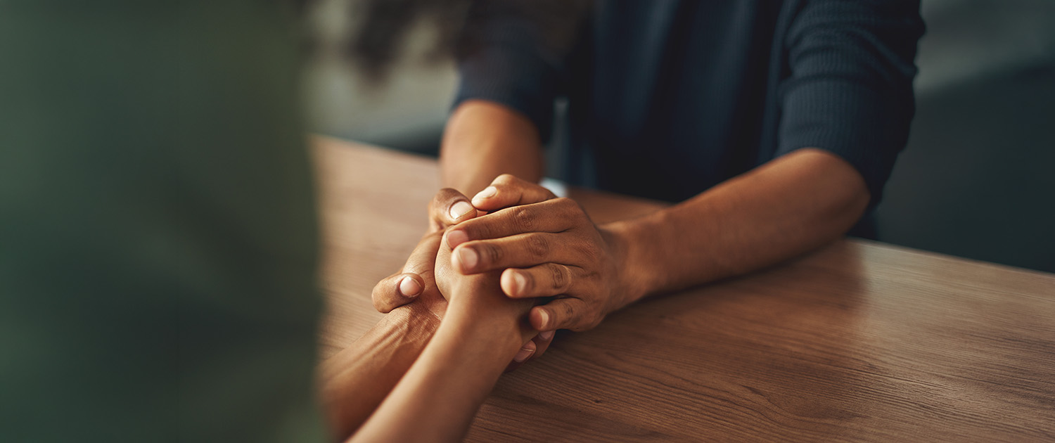 caring friend holding hands
