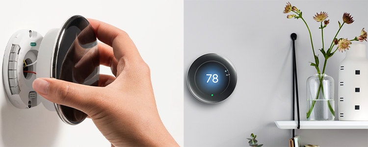 Nest thermostat being installed on wall