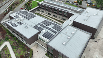 Aerial view of rooftop solar panels at Pine Lake Community Solar generation site