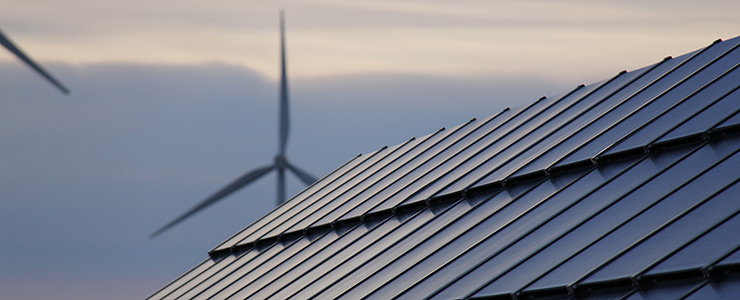 Roof with wind turbine in background