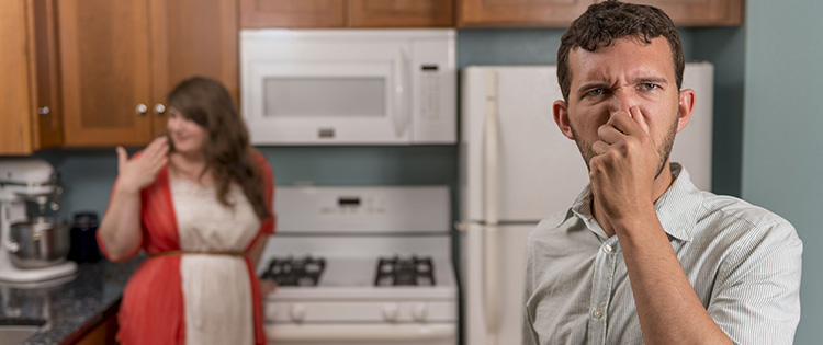 Couple detecting natural gas odor in their home