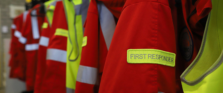 High-visibility reflective jackets worn by emergency first responders