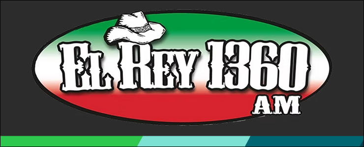 A red, white and green striped oval on a black background with the radio station name "El Ray 1360 AM" in an old west style font, a cowboy hat tops the letter R