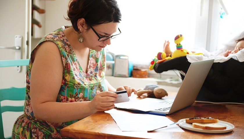 Woman at table on computer