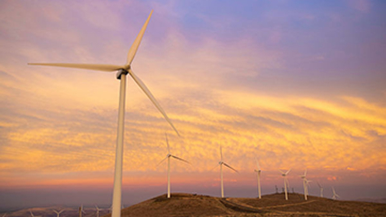 Wind turbines at sunset
