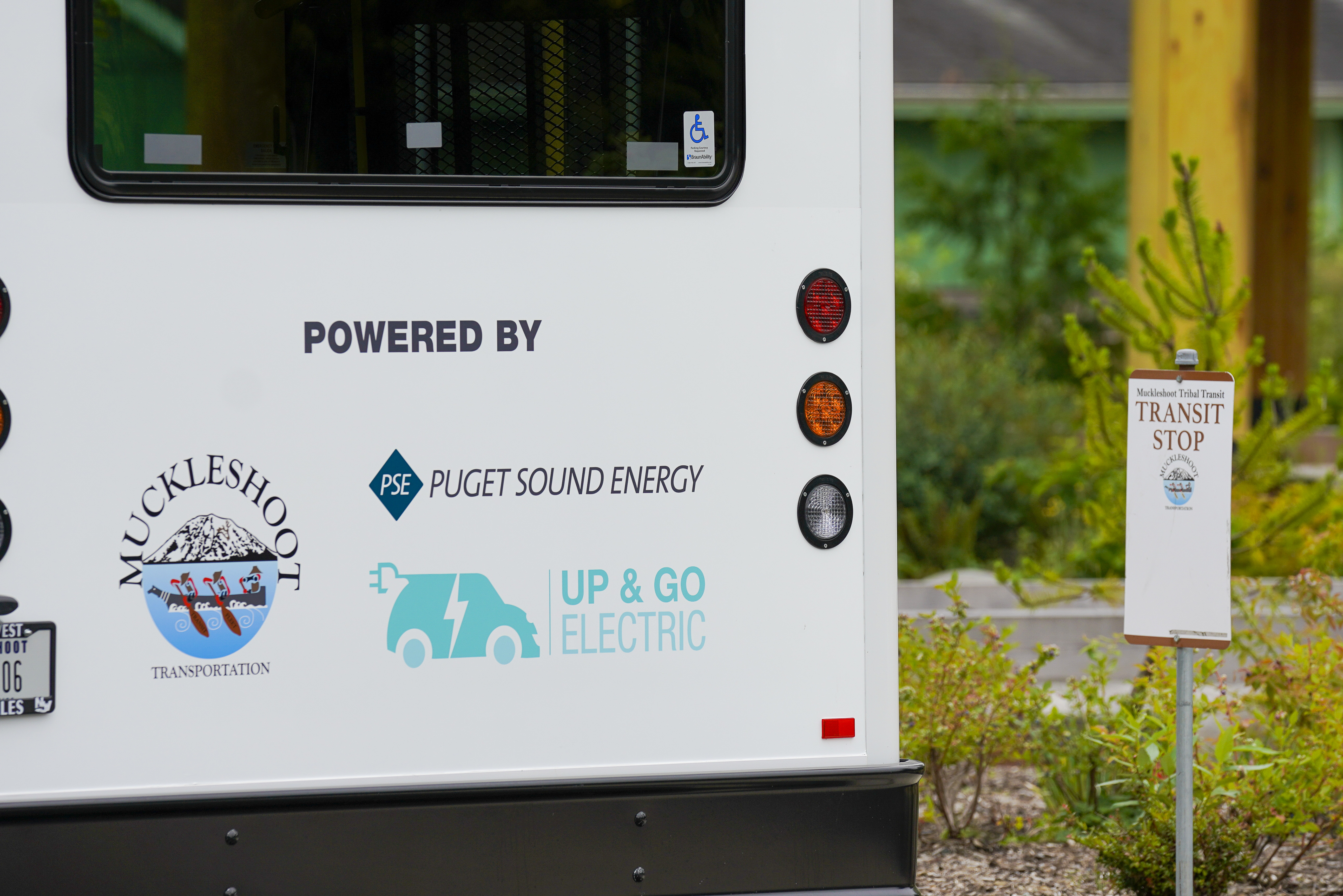 Muckleshoot Transportation Department displaying PSE Up & Go Electric logos