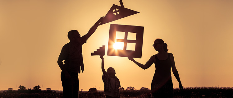 Happy family at sunset