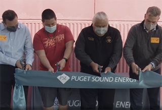Representatives from PSE and the Lummi Nation School cut the ribbon on the school’s new solar array, which was funded through a Green Power Solar Grant.